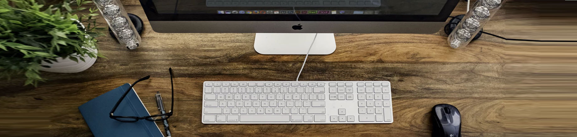 keyboard, glasses, book, mouse on clinician's desk