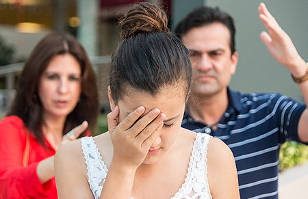 teenage girl arguing wiht parents